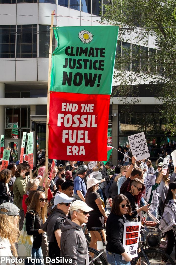 Climate activist in yellow vest at protest event